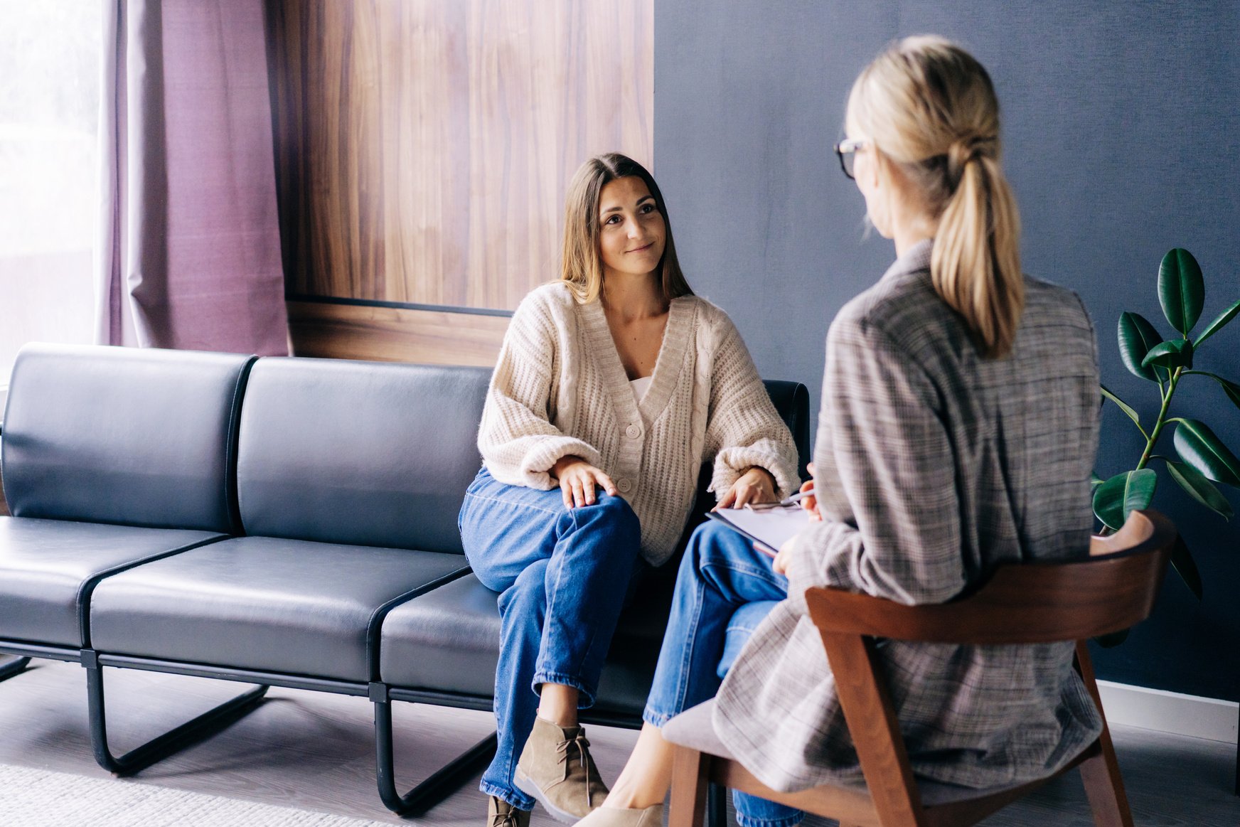 Smiling Woman Listening to a Psychologist.